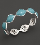 Sky blue enamel drops over a carved sterling silver bangle By Elizabeth Showers.