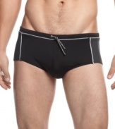Get comfortable. Consistently look and feel at your best in these classic brief swim trunks from Calvin Klein.
