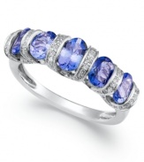 A true beauty. This stunning ring features five oval-cut tanzanite stones (1-5/8 ct. t.w.) accented by rows of certified, round-cut diamonds (1/4 ct. t.w.). Set in sterling silver. Size 7.