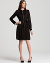 An exposed front zip and romantic ruffle bring downtown allure to this classic Elie Tahari shirt dress.