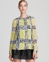 A bold, graphic print infuses this DIANE von FURSTENBERG top of rich silk with artsy flair.