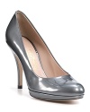 These pretty patent leather pumps rise on a flattering 1/2 platform--the height of timeless style. By Salvatore Ferragamo.