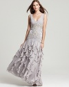 Cascading ruffles create graceful movement on this gala-ready Sue Wong gown, crowned with a bodice of opulent beading.
