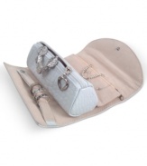 The ultimate travel accessory, the Jenna jewelry roll keeps your favorite pieces within reach when you're on the road. Featuring a faux leather exterior, crocodile feel and silvertone metal heart pull for glamor on the go.