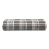 Inspired by the refined polish of menswear, this relaxed collection pairs solid brushed cotton and twill with faux suede trim and plaid. Sheets and pillowcases are in a soft cotton bold plaid in a grey and white palette.