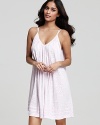 A flowy chemise with tonal floral print all over and tonal stripe trim at hem.