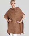 The poncho goes luxe with this reinterpretation by Rachel Zoe, crafted with a dramatic neckline and a long tunic length.