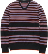 Stripe it rich in your seasonal wardrobe with this bold sweater from Sean John.