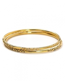 Melinda Maria's set of three gold bangles are a perfect complement to breezy bohemian looks. Wear the stack solo, or copy the cool-girls with a gilded wristful.