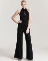 ABS by Allen Schwartz reinvents after-dark elegance with this ultra-sleek halter jumpsuit.