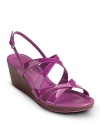 A strap-happy platform sandal in shiny patent. From Cole Haan.