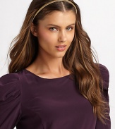 A neat, lightweight design with an elastic back. Metal About ½ wide Made in USA of imported materials 