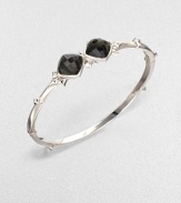 From the Superstud Collection. Two diamond-shaped faceted cushions of clear quartz layered over faux cat's eye create a dramatic look in a bangle of bright sterling silver dotted with pointy studs.Synthetic cat's eye and clear quartzRhodium-plated sterling silverDiameter, about 2.25Box-and-tongue claspImported