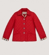 A cozy quilted jacket with a check lined collar and button front.