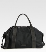 This spacious, versatile bag has an array of pockets for all of your essentials, structured in a sturdy canvas with leather trim for a refined finish.Zip closureTop handlesRemovable shoulder strapExterior, interior zip pocketsCotton liningCanvas/leather20W x 10 x 9DImported