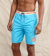 A student of summer style. These prepster swim shorts from Tommy Hilfiger will have you beach-ready.