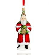 No one welcomes the season like Santa. Bearing a fresh pineapple, St. Nick revives a classic holiday tradition in this mouth-blown, hand-painted glass ornament from Vaillancourt.