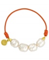 Majorica explores its whimsical side with this bracelet. Organic man-made pearls (8 mm) adorn an orange elastic cord for  a fun and fashionable look. Approximate length: 6-1/2 inches.