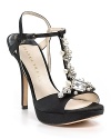 Softly shimmering satin t-straps go glam with the addition of bold, faceted rhinestones. By IVANKA TRUMP.