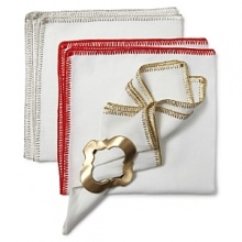 Delicate, metallic stitching adds sparkle to a classic linen napkin. Delicate, metallic stitching adds sparkle to a classic linen napkin.