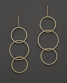 Interlocking 14K. yellow gold hoops evoke bohemian elegance. By Lana. Interlocking 14K. yellow gold hoops evoke bohemian elegance. By Lana.