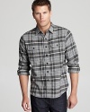 Treading that fine line between rugged and refined, this soft flannel plaid shirt breaks through for a powerful addition to your closet.