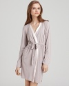 Calvin Klein Underwear Essentials short robe. A soft short robe with tie at waist, trimmed with satin. The perfect cover up.