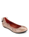 A sleek silhouette and feminine lace-up detail make these your must-have flats. From Cole Haan.