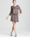 Glittering sequins sparkle on this Adrianna Papell dress, cut in a blouson silhouette for a billowy, ethereal look.