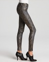 A metallic snake print lends rich exoticism to these J Brand skinny jeans.