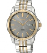 Embrace contemporary and classic style with this energy-efficient watch by Seiko. Brushed and polished two-tone stainless steel bracelet and round case, 39mm. Gunmetal dial features applied gold tone stick indices, minute track, day and date window at three o'clock, LumiBrite hands and logo. Solar-powered quartz movement. Water resistant to 100 meters. Three-year limited warranty.