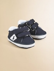 Classic canvas sneakers for your baby with grip-tape closure and embroidered ponies.Hook-and-loop straps with grip-tape closureCanvas upperCotton liningCanvas solePadded insoleImported