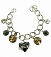 For the wild at heart, this charm bracelet from GUESS is crafted from silver-tone mixed metal with jet and glass crystal accents bringing a stylish edge. Leopard print enhances the animal attraction. Item comes packaged in a signature GUESS Gift Box.  Approximate length: 7-1/2 inches. Approximate drop: 1 inch. Approximate diameter: 1-1/2 inches.