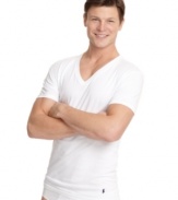 In a super comfy, soft cotton, this body-hugging tee is a great fit under clothes or even alone. Logo applique at hem.