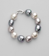 A stunning bracelet of baroque pearls in a palette of whisper soft pastels. 14mm white, grey and nuage man-made organic pearls Length, about 8 Rhodium-plated sterling silver spring clip clasp Made in Spain