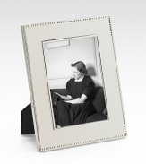 A stunning display for a treasured photograph, designed in heirloom-quality sterling silver with tiny-bead trim. Accommodates a 5 X 7 photograph Overall, 7 X 9 Sterling silver Made in USA 