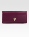 Luxurious saffiano leather with an elegant logo emblem.Magnetic snap flap closureOne inside zip pocketTen credit card slotsTwo bill compartmentsLeather lining7½W X 3½H X 1DImported