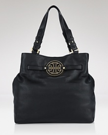 A bold signature logo brands this textured leather tote with classic style. By Tory Burch. A bold signature logo brands this textured leather tote with classic style. By Tory Burch.