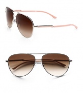 A modern take on a classic design in sleek metal with acetate logo temples. Available in gold/blond tortoise with brown gradient lens or silver/nude with brown gradient lens. Logo temples100% UV protectionMade in Italy 