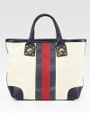 Striped Intreccio canvas pairs with rich leather in this roomy carryall with signature web detail.Double top handles, 5¾ dropOne inside zip pocketTwo inside open pocketsLinen lining15¼W X 14H X 6DMade in Italy