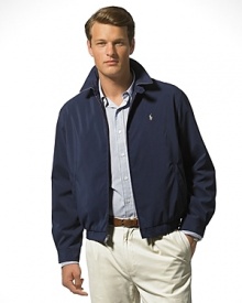 Classic fitting, zip-front windbreaker in high performance, sueded microfiber. Accented with tattersall cotton twill body lining. Buttoned throat latch, elastic waistband and buttoned cuffs. Slash pockets provide easy access and comfort. Inside pocket. Bi-swing construction for ease of movement. Polo's signature embroidered pony accents the chest. Classic fitting, zip-front windbreaker in high performance, sueded microfiber. Accented with tattersall cotton twill body lining. Buttoned throat latch, elastic waistband and buttoned cuffs. Slash pockets provide easy access and comfort. Inside pocket. Bi-swing construction for ease of movement. Polo's signature embroidered pony accents the chest.