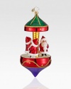 Miniature Santa figurines are set atop this glittery Christmas carousel. Hand-blownHand-painted6½ highMade in Poland