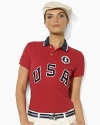 An essential short-sleeved polo shirt is crafted in breathable cotton mesh with bold country embroidery, celebrating Team USA's participation in the 2012 Olympics.