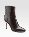 From the 24:7 collection. Modern leather bootie shaped to a point toe with seam detail for added definition.Self-covered heel, 3½ Shaft, 4½ Leg circumference, 9½ Point toe Three-quarter back zip Leather lining and sole Made in ItalyOUR FIT MODEL RECOMMENDS ordering one half size up as this style runs small. 