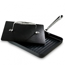 The two piece nonstick panini press lifts off to function as a grill pan. The two piece nonstick panini press lifts off to function as a grill pan.