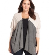 Layer your favorite looks with Design 365's colorblocked plus size cardigan, featuring an open front design.