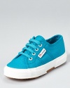 Superga offers up a classic running sneaker look in lightweight canvas, a comfy way to send them to school with style.