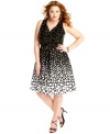 Party in polka dots with Spense's sleeveless plus size dress, defined by a flattering A-line shape.