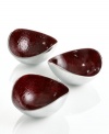 Full of surprises, these handcrafted nut bowls from the Simply Designz collection of serveware and serving dishes feature sleek, polished aluminum lined with lustrous burgundy enamel. A bold set for serving snacks or simply decorating the table.