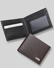 Salvatore Ferragamo Revival bifold wallet. Textured leather bifold wallet with silver engraved Ferragamo plate on front. Features double billfold with three card slots on one side and one window slot with two card slots on the other . Salvatore Ferragamo Revival bifold wallet. Textured leather bifold wallet with silver engraved Ferragamo plate on front. Features double billfold with three card slots on one side and one window slot with two card slots on the other .